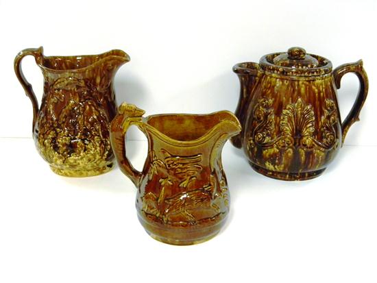 Three Rockingham type glazed pitchers 120d16