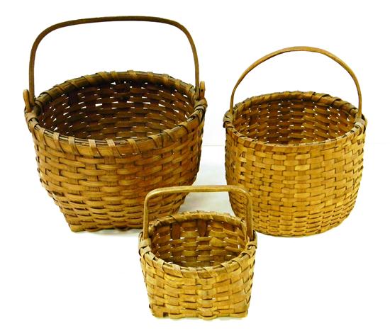 Three woven baskets: one with flat arch
