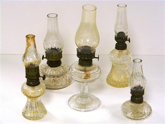 Five colorless pressed glass oil