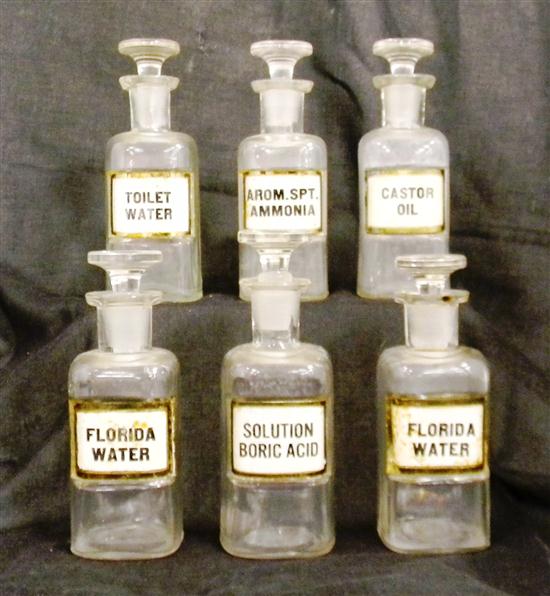 Six apothecary bottles labeled 120d87