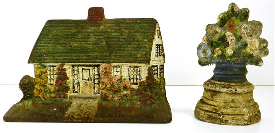 Two iron doorstops: a cottage signed