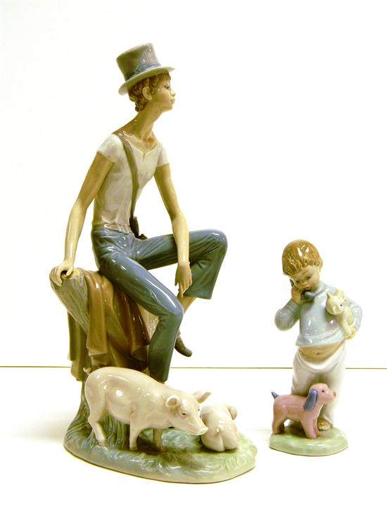 Two Lladro figurines: boy in top