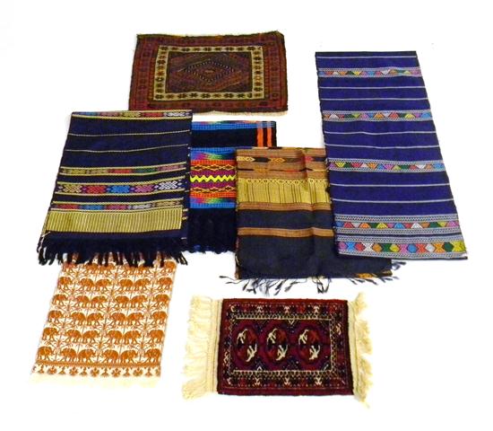 Five Asian textiles and two small rugs