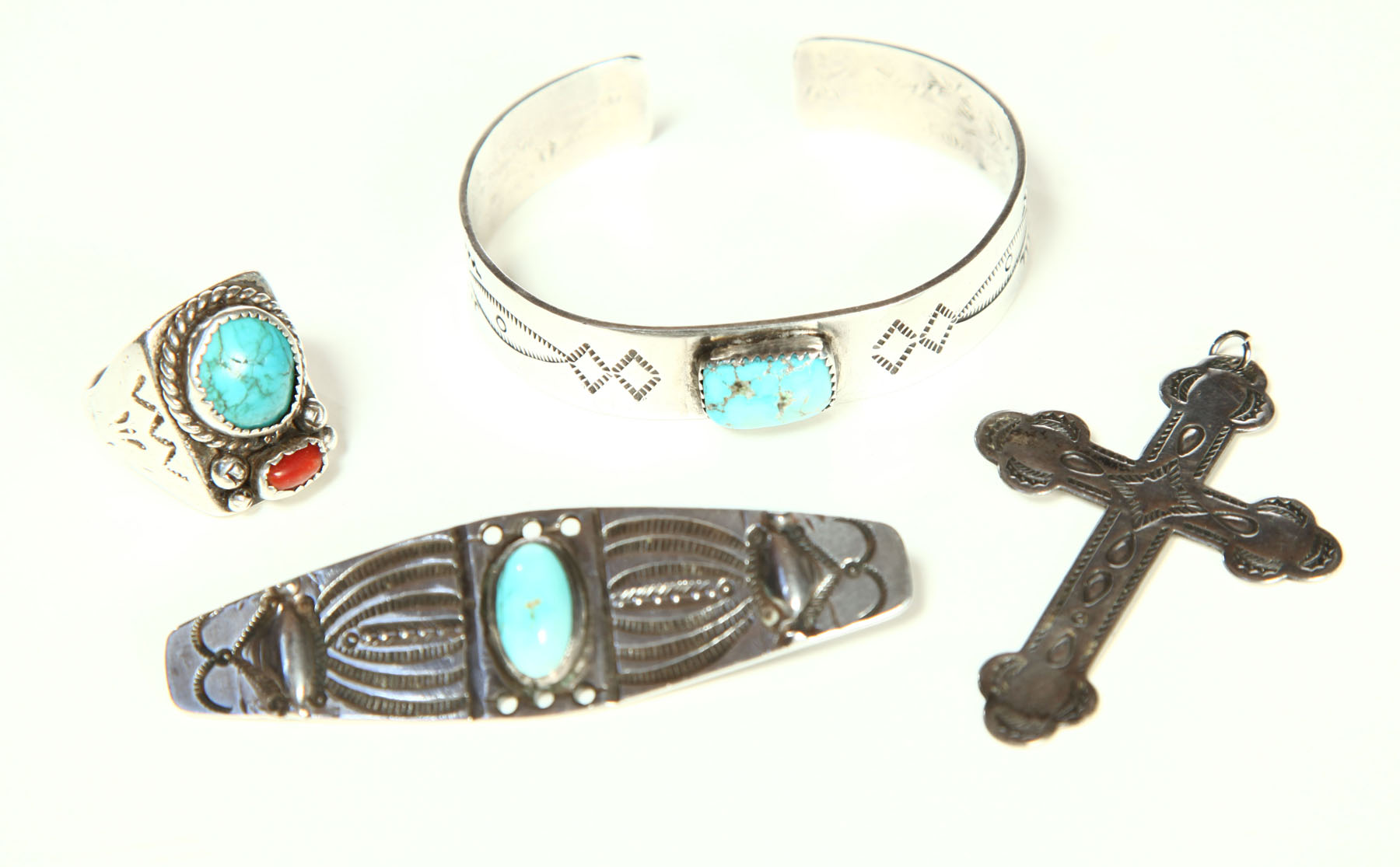 FOUR PIECES OF NAVAJO JEWELRY.