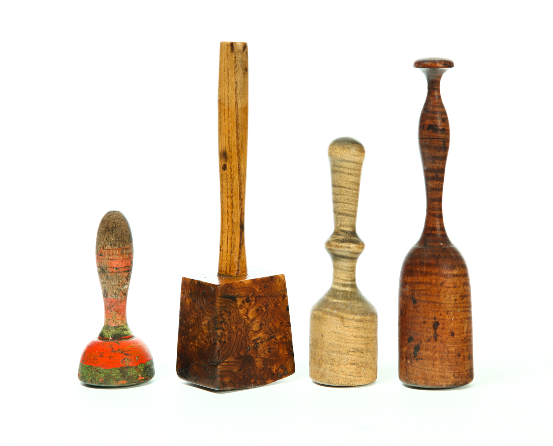 FOUR WOODEN MALLETS AND PESTLES.