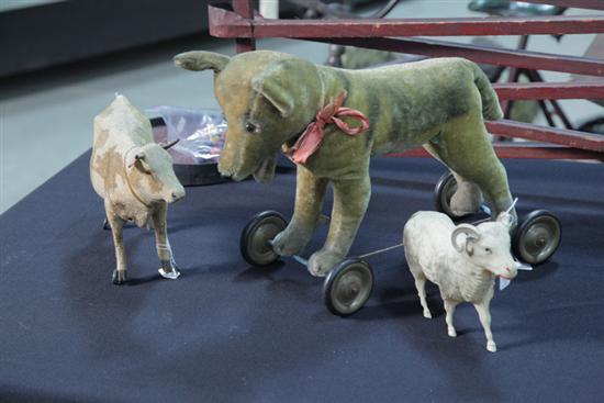 THREE TOY ANIMALS. One cow pull