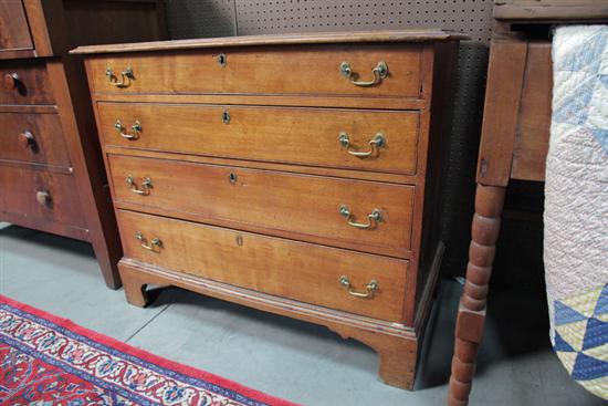 CHEST OF DRAWERS. Mixed woods having