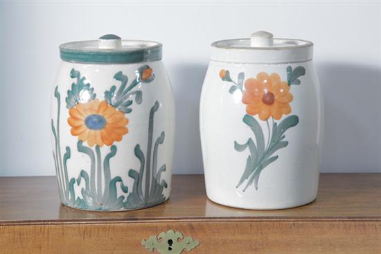 TWO POTTERY JARS. Each with lids