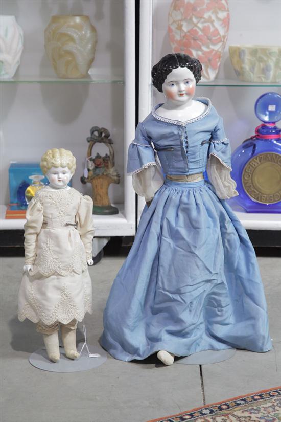 TWO DOLLS. A China head doll with