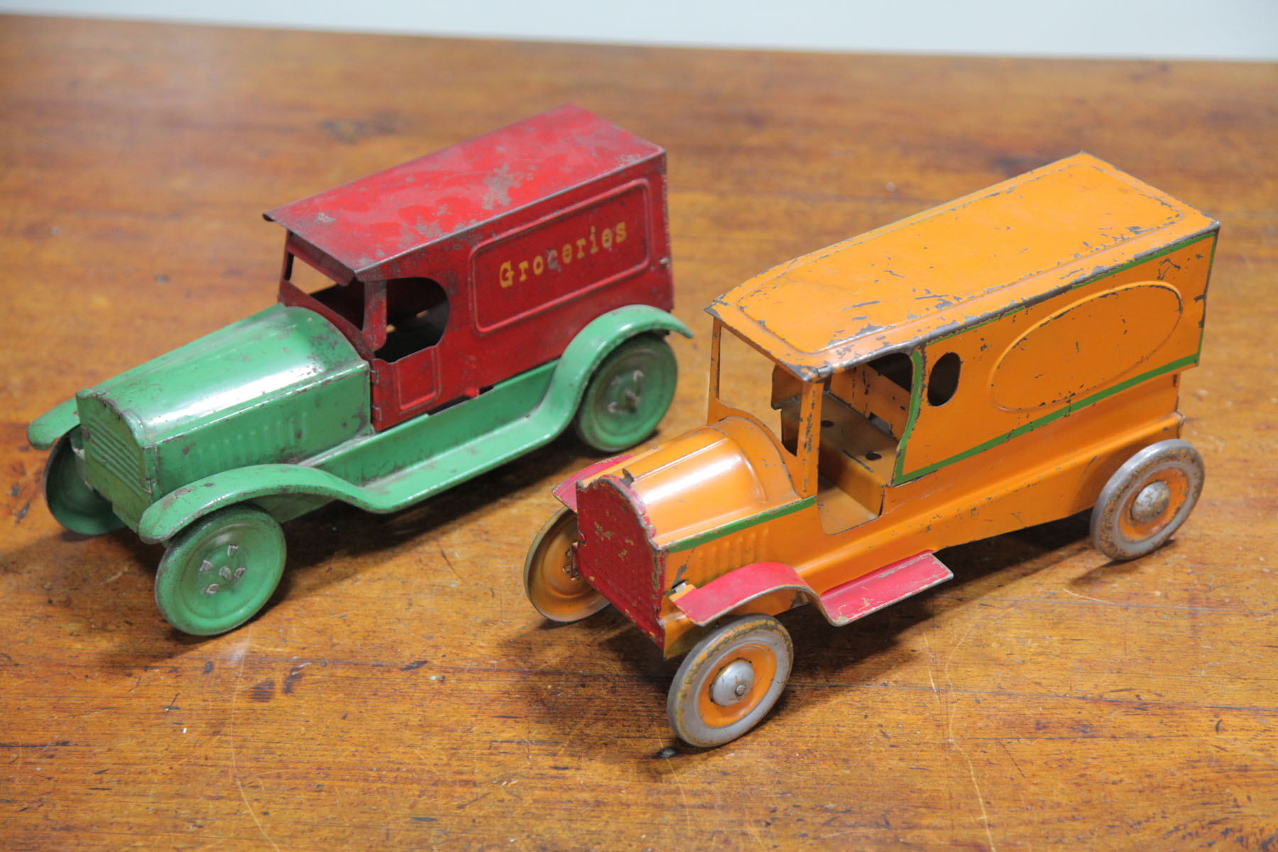 TWO TIN TRUCKS.  American  first half