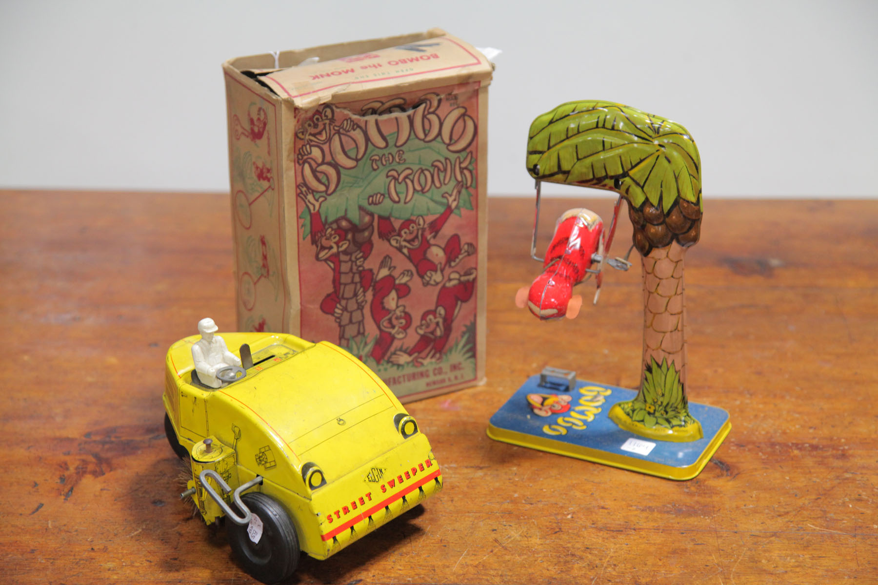 TWO TIN WIND-UP TOYS  ONE WITH BOX.