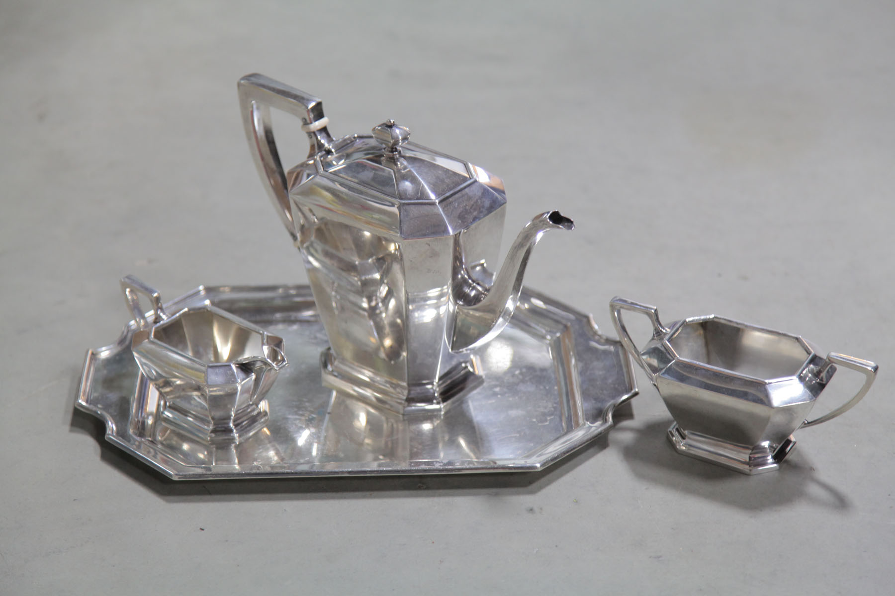 FOUR PIECE STERLING SILVER TEA SET.