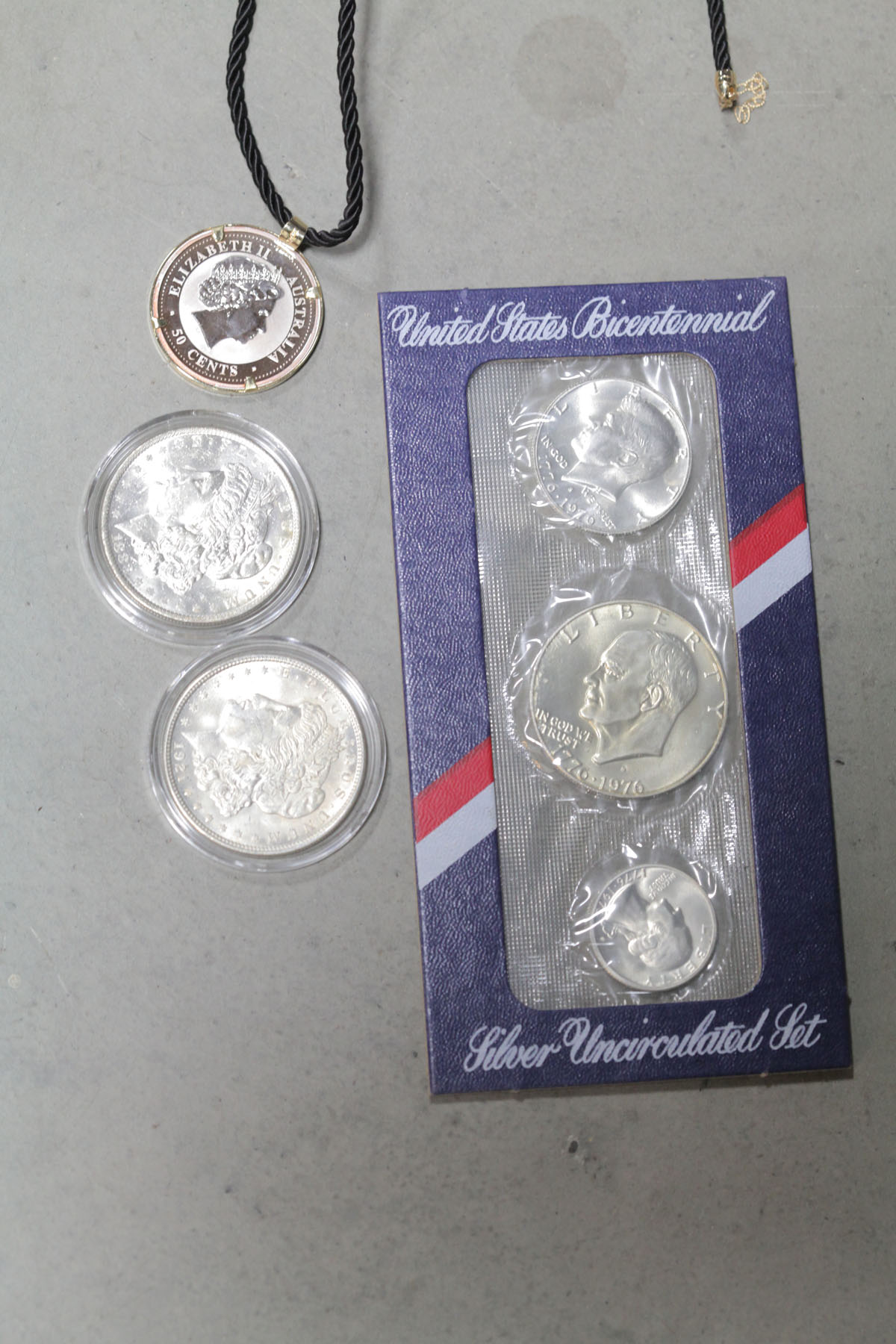 THREE COINS AND A BICENTENIAL UNCIRCULATED