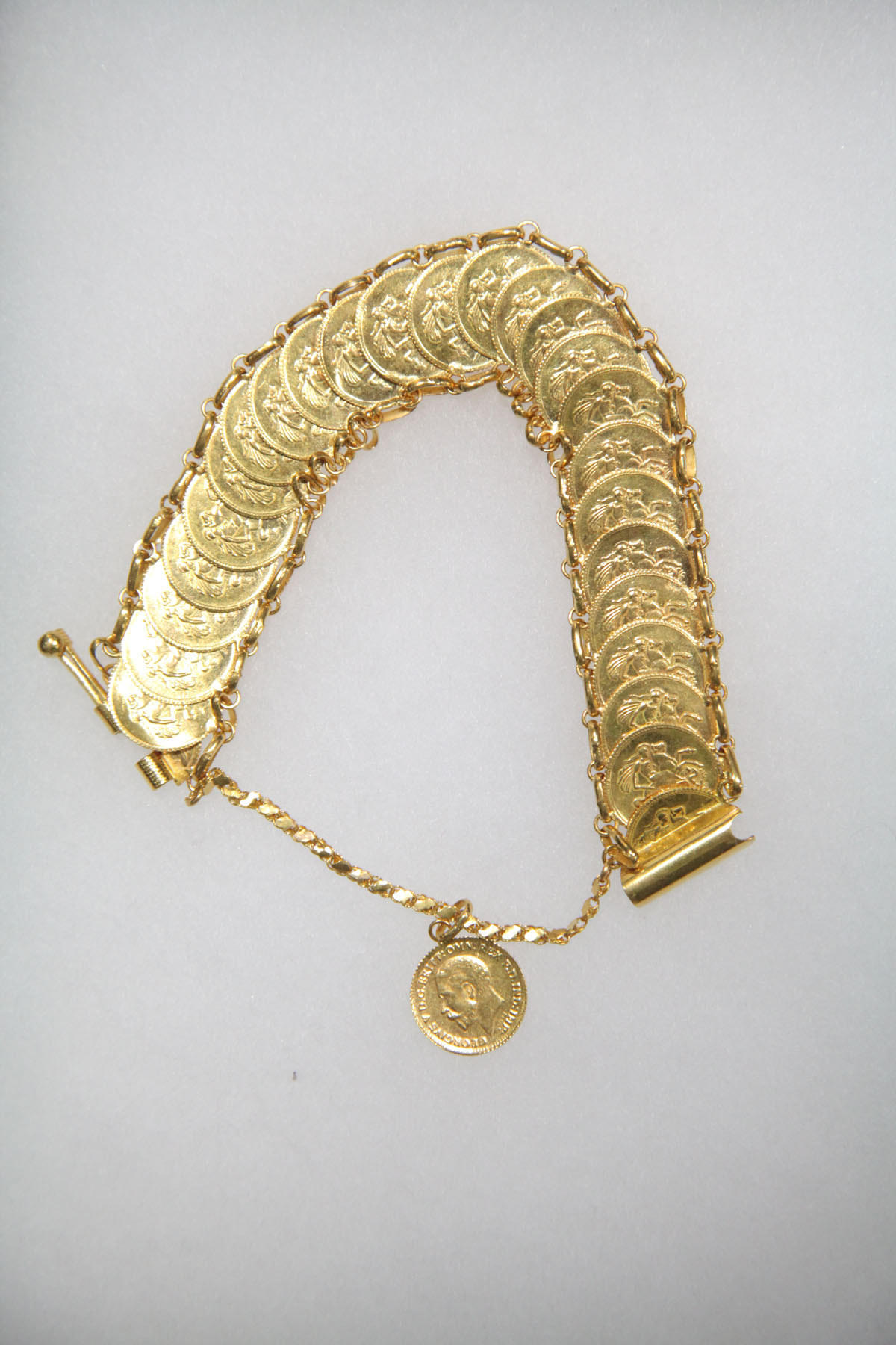 GOLD COIN BRACELET.  Twenty-five faux