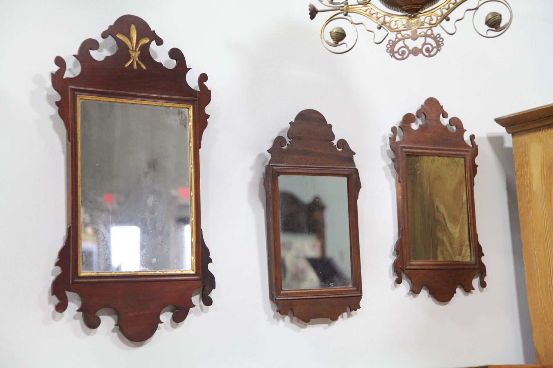 THREE SMALL CHIPPENDALE STYLE MIRRORS.