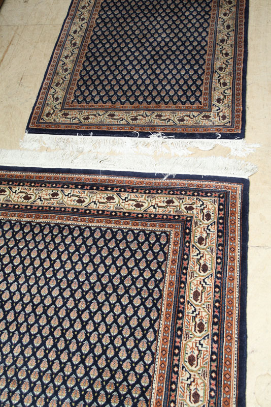 TWO ORIENTAL STYLE AREA RUGS. Both