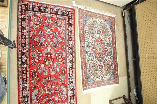 TWO ORIENTAL RUGS. A runner with