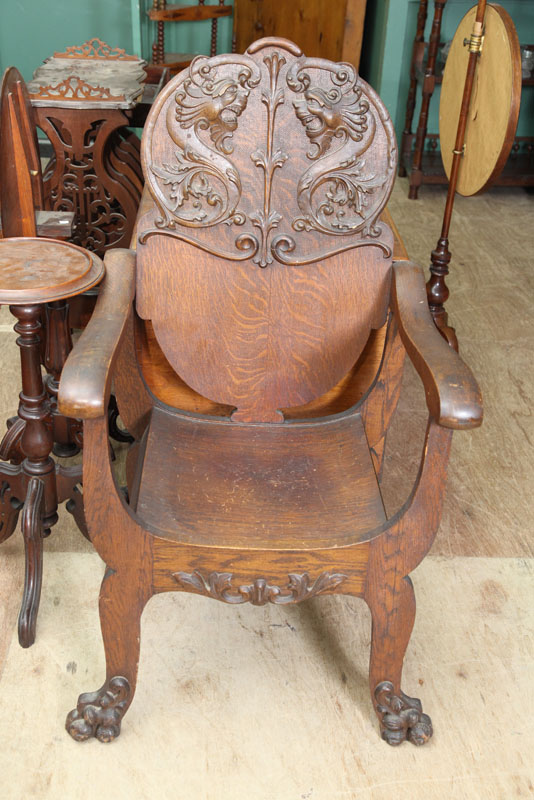 OAK ARMCHAIR. Pressed back chair with
