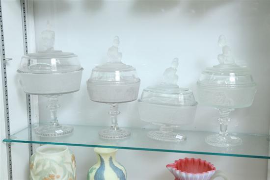FOUR PATTERN GLASS COVERED COMPOTES.