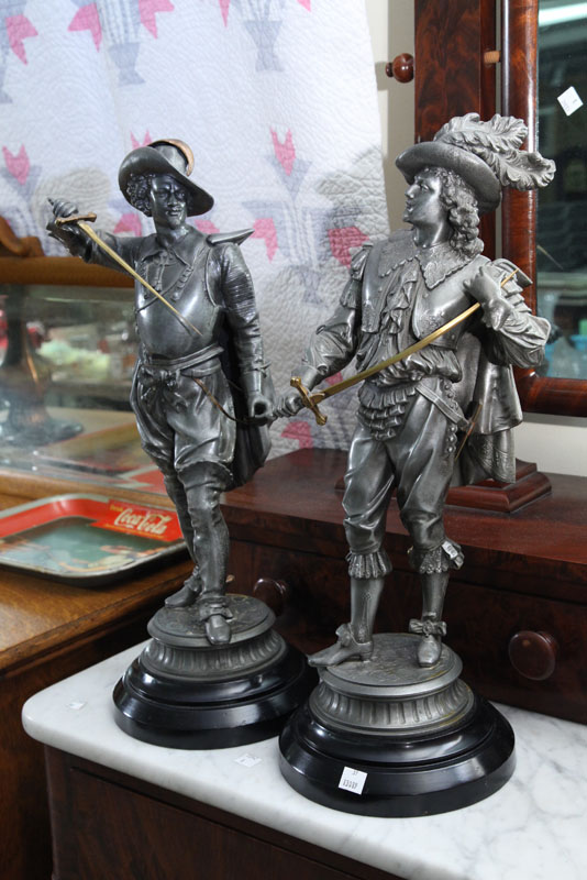 TWO MUSKETEER STATUES. Spelter