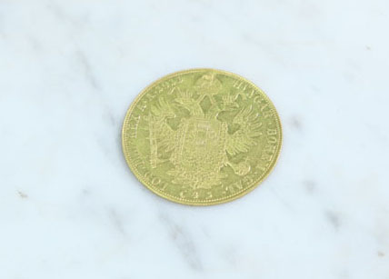 COIN. Possibly gold- 8.8dwt.
