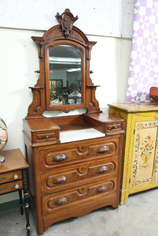 VICTORIAN DRESSER. Walnut having a carved