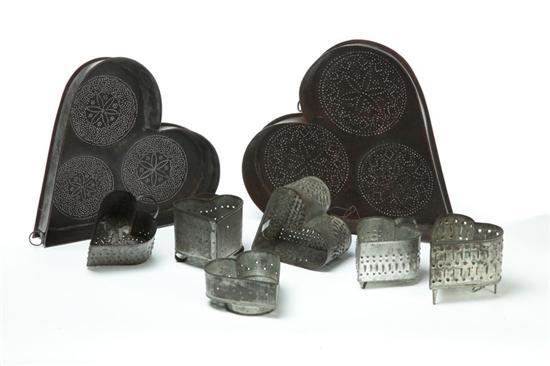 EIGHT TIN HEART MOLDS.  American  early