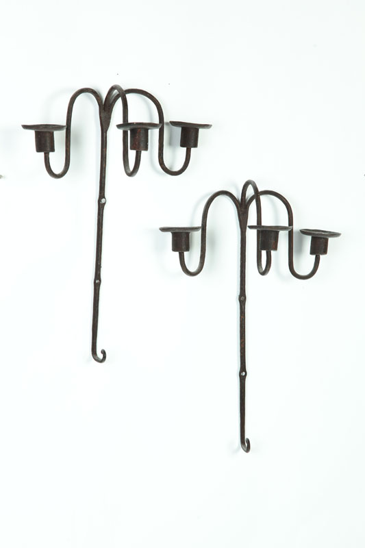 TWO WROUGHT IRON CANDLESCONCES.