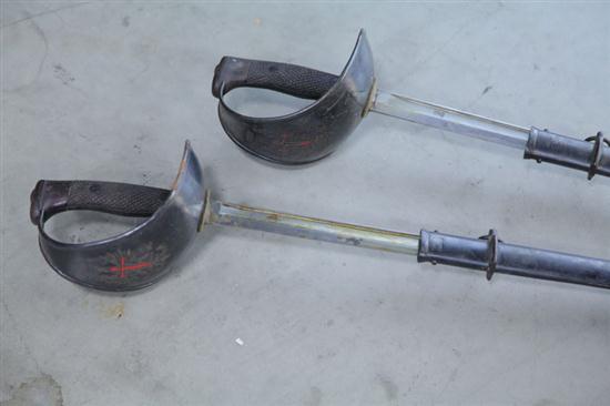 TWO CUTLASS SWORDS. Both with Red