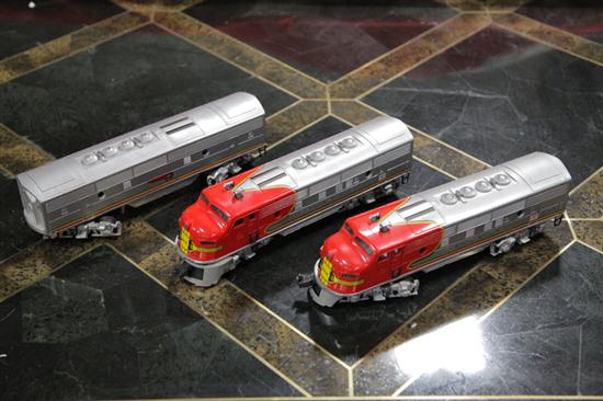 THREE LIONEL TRAIN CARS. Two 2343 Santa