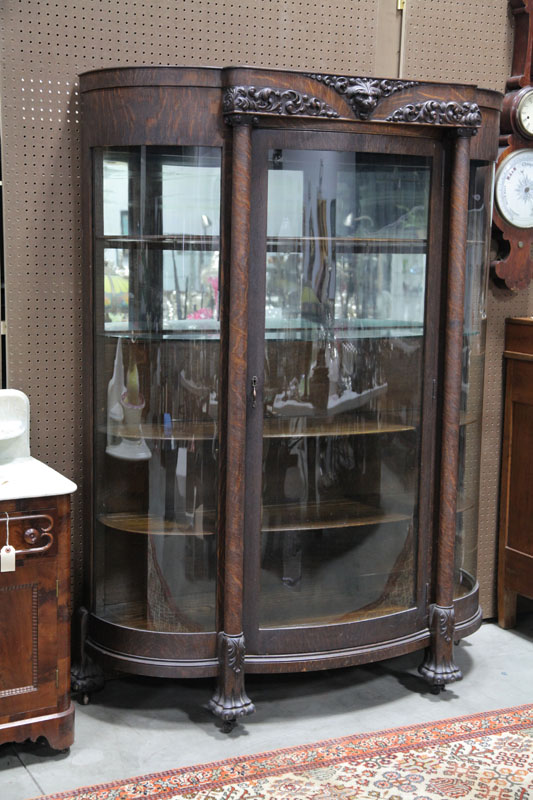 CHINA CABINET. Oak with a lions head