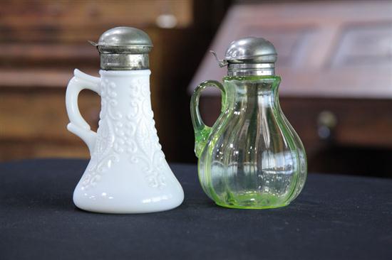TWO ART GLASS SYRUPS. A milk glass