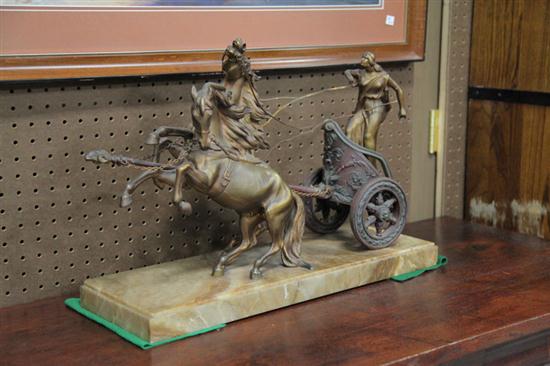 SCULPTURE OF A HORSE DRAWN CHARIOT