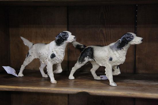 TWO CAST IRON HUNTING DOG DOOR STOPS.