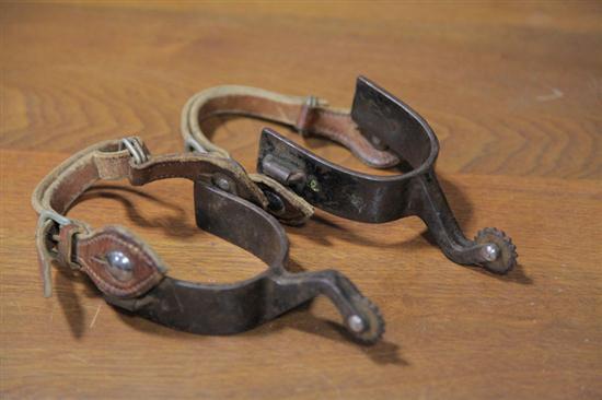 PAIR OF SPURS. Brown leather straps