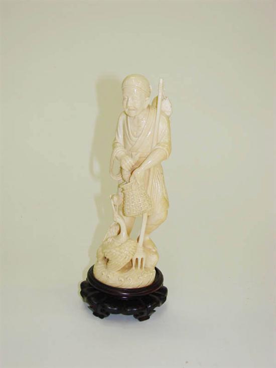 IVORY CARVING OF A FISHERMAN  1235a4