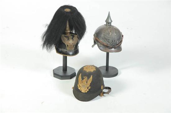 THREE MILITARY HELMETS Marked 12377a