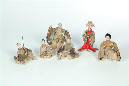 SIX CARVED AND PAINTED DOLLS.  China