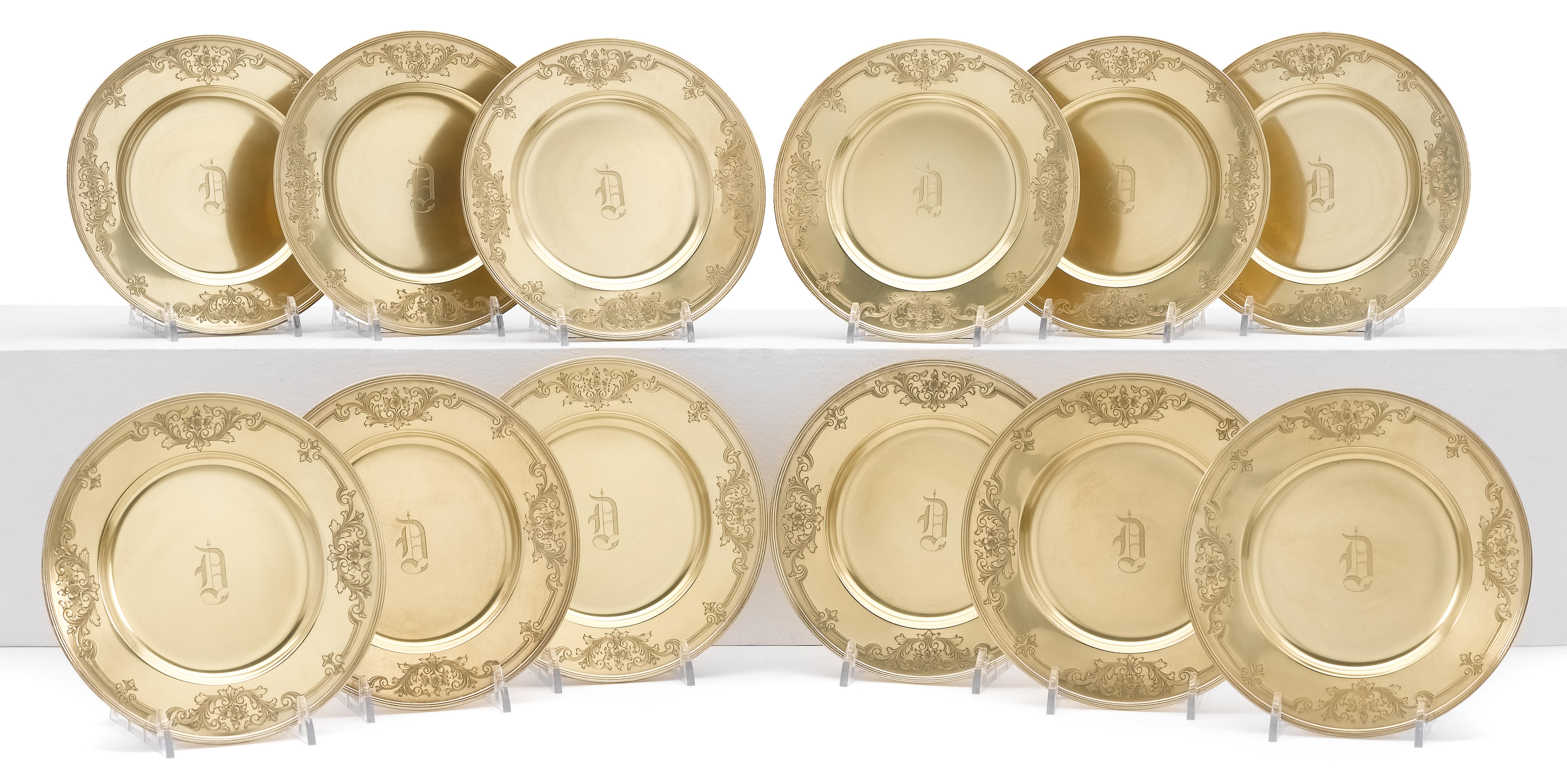A sterling-gilt set of thirty six bread