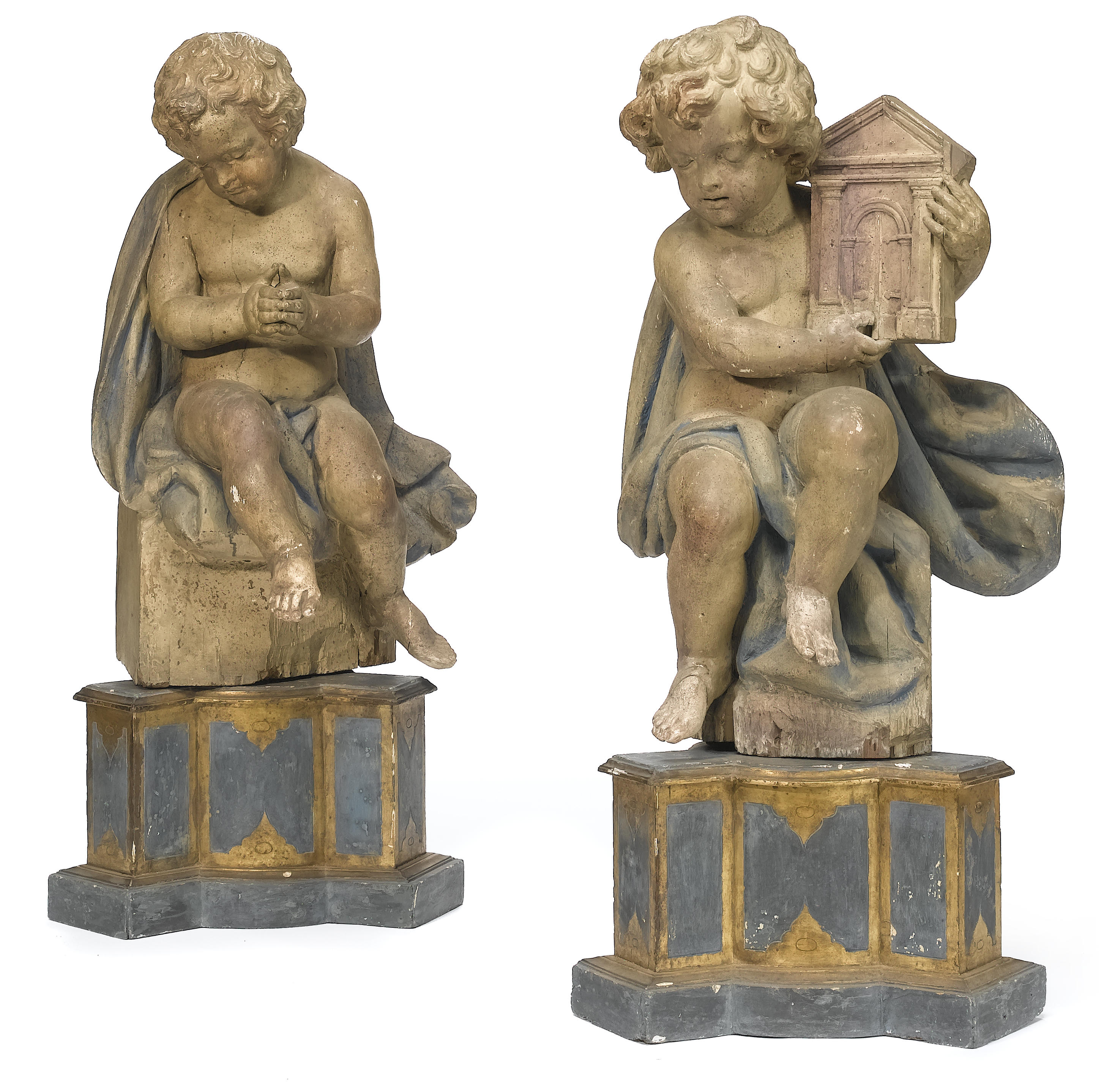A pair of Italian carved wood figures