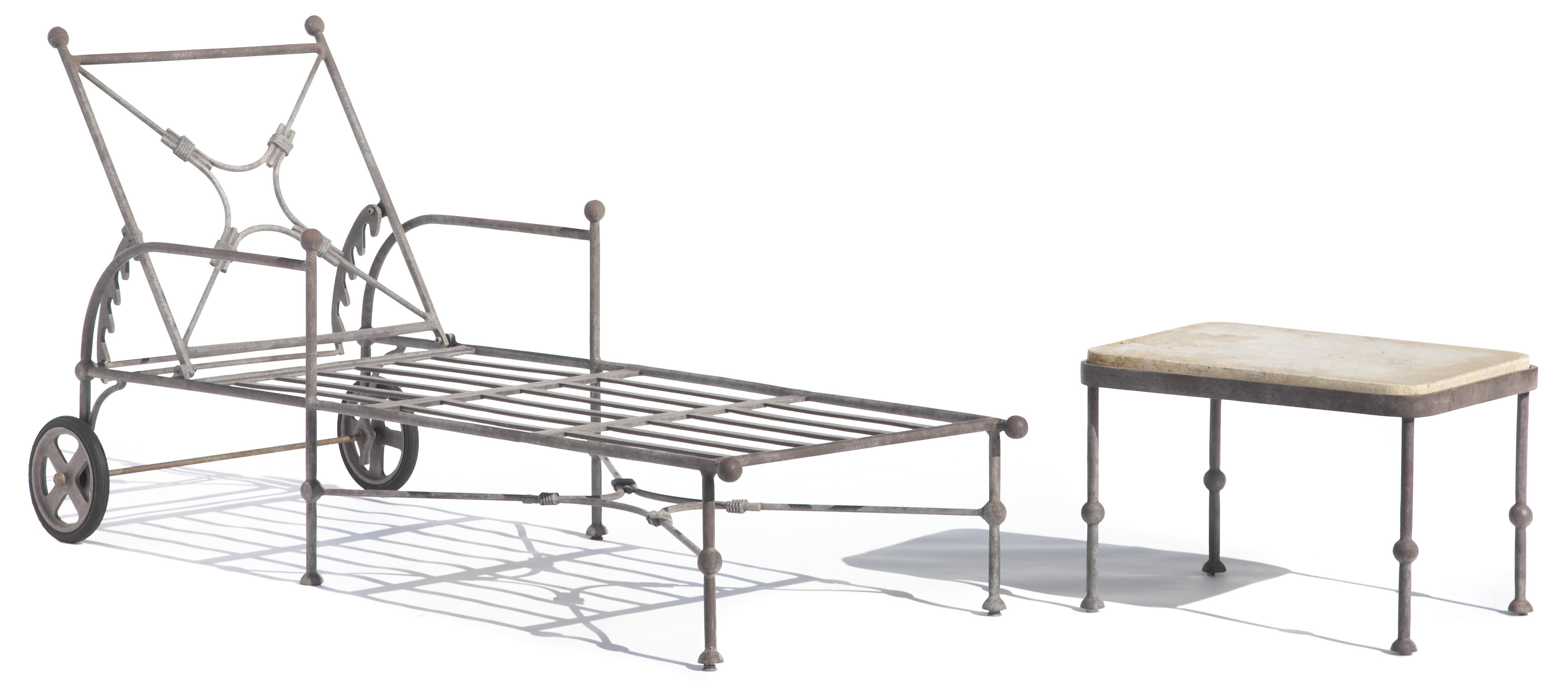 A suite of patinated metal garden furniture