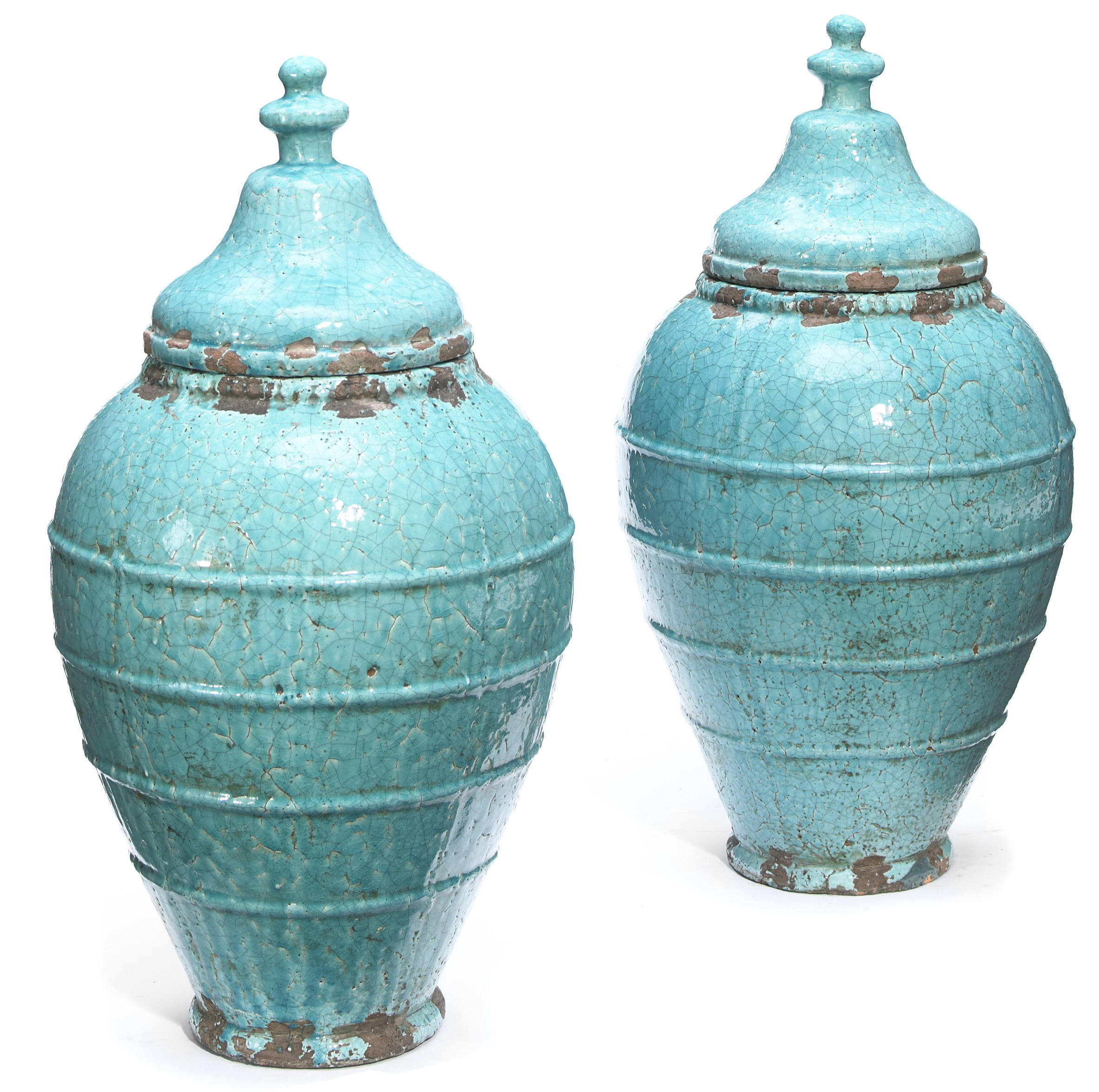 A pair of glazed earthenware covered
