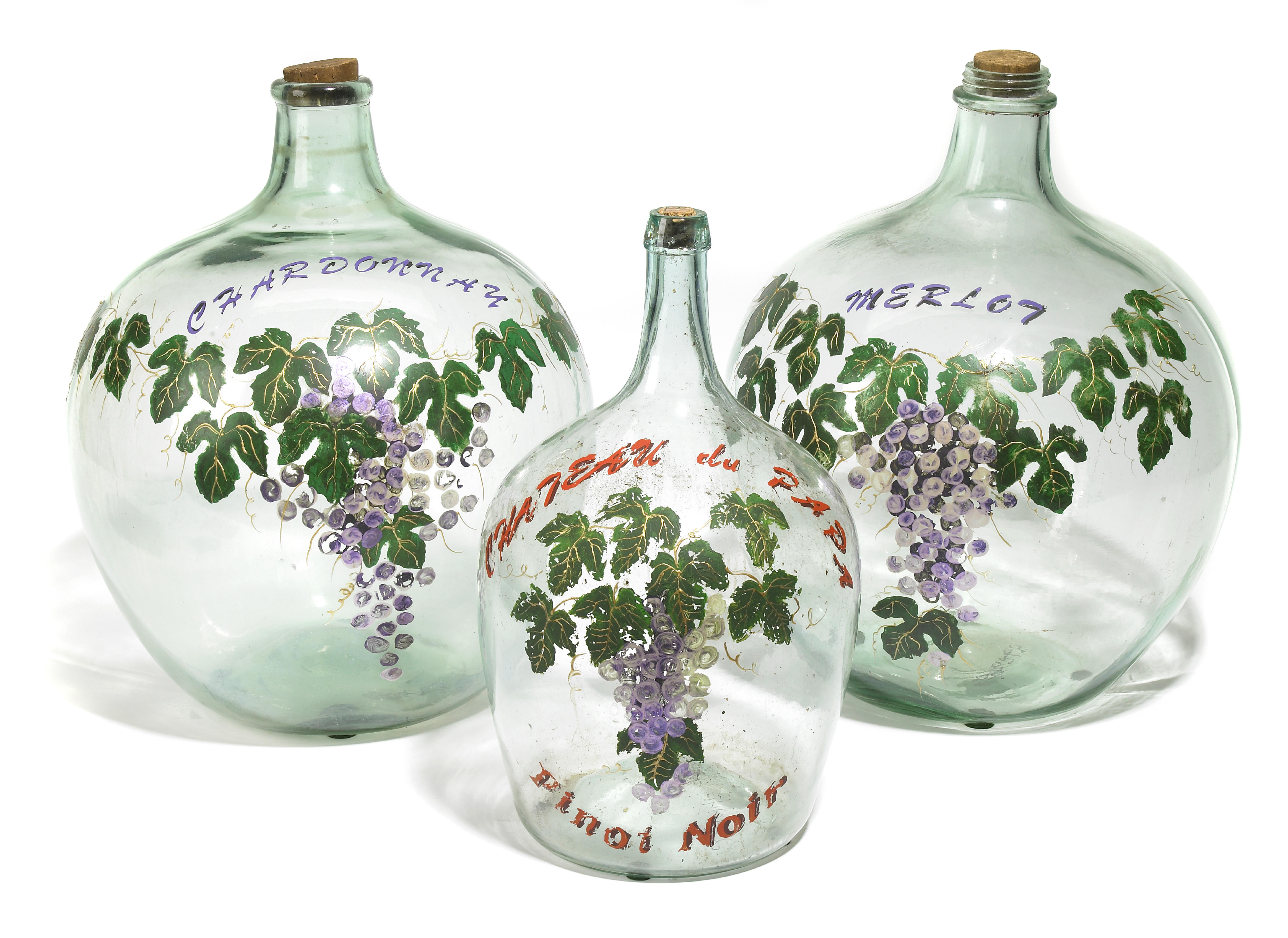 A group of three paint decorated glass