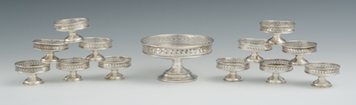 A Set of 12 Small Silver Dishes