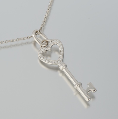 A Tiffany & Co 18k and Diamond Key Pendant