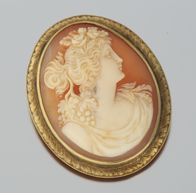 A Ladies' Carved Shell Cameo Brooch