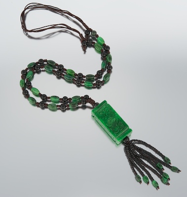 A Carved Jadeite and Onyx Tassel 13255d
