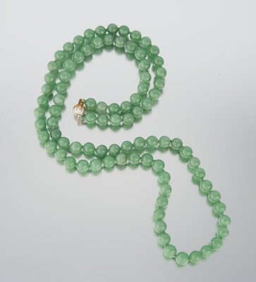 A Carved Jade Bead Necklace 14k