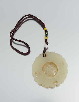 A Carved Jade Pendant with Butterfly