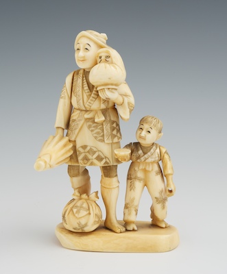 A Carved Ivory Figural Group Depicting